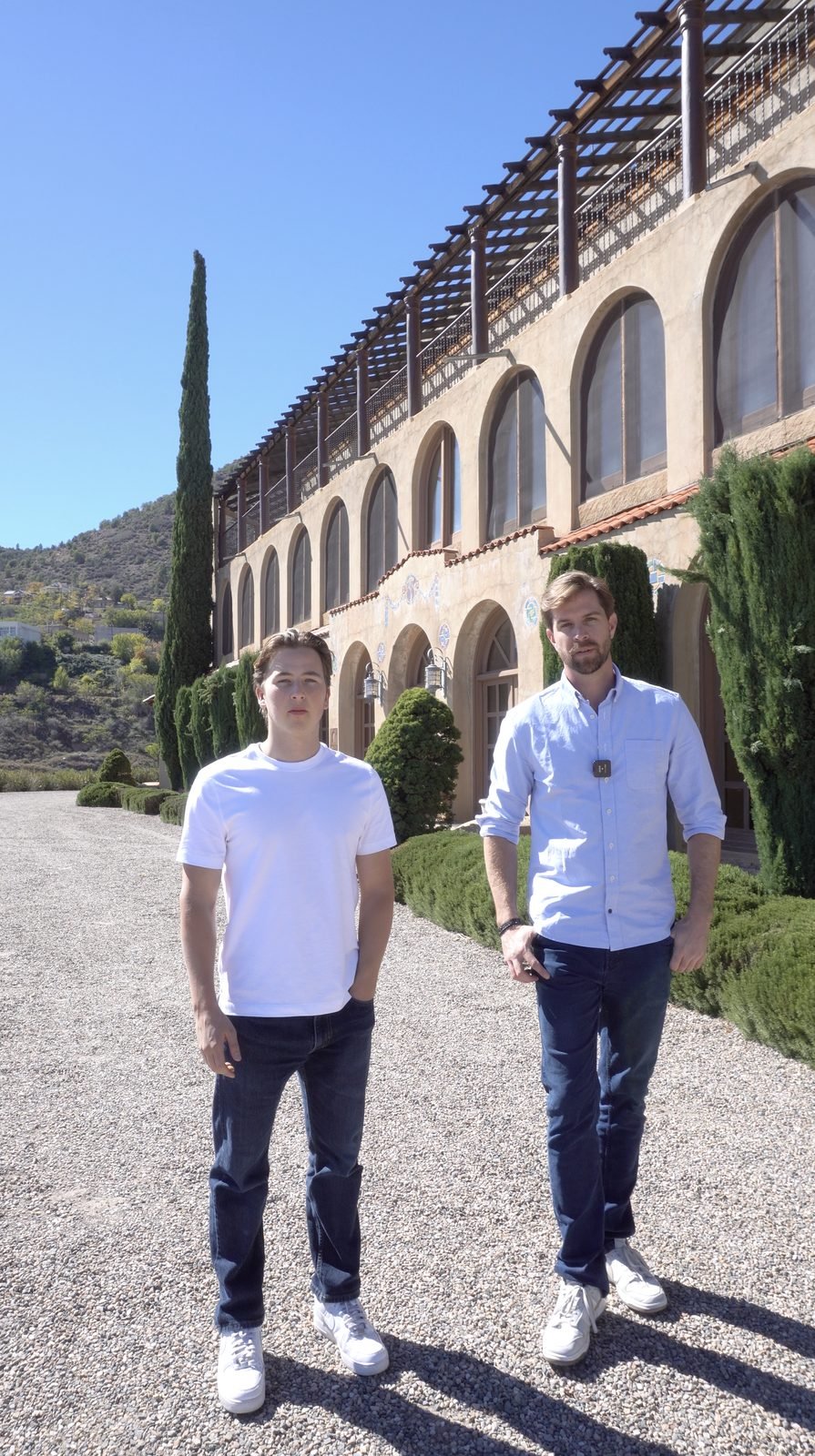 Yewan Fitz-Earle with Brian Grooms, owner and developer, in front of the arched facade of The Little Daisy in Jerome, Arizona